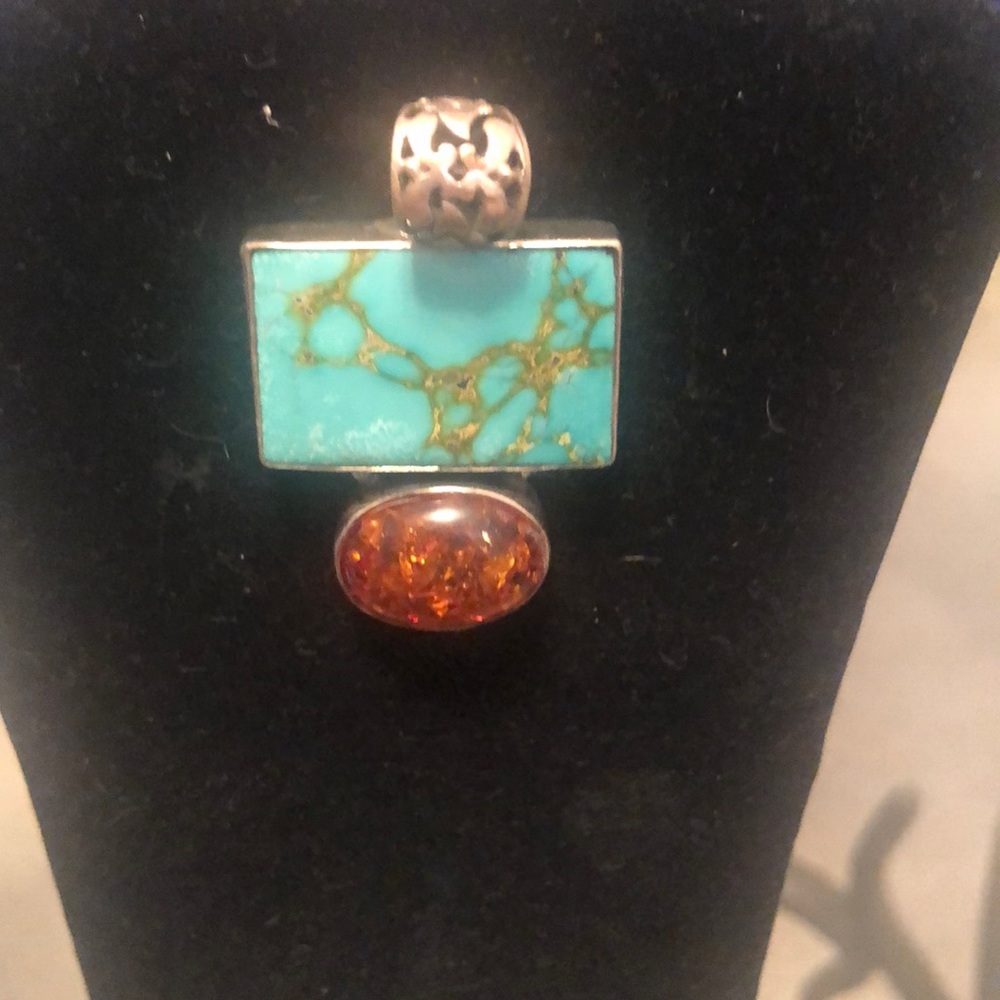 Large Turquoise pendant set in sterling silver with a large oval amber stone